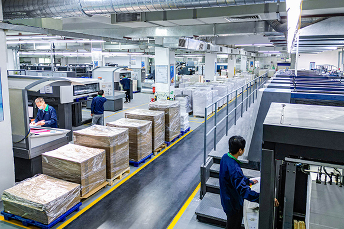 Grnpak's packaging team at our China manufacturing facility, working on custom gift box production and sustainable packaging solutions with focus on quality and eco-friendly materials.